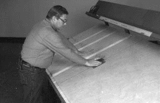 Fig. 10. Hand grooving fibrous glass duct board
