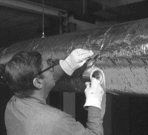 Fig. 22. Fibrous glass duct wrap may be installed on round, oval, or rectangular ducts after joints have been tightly sealed